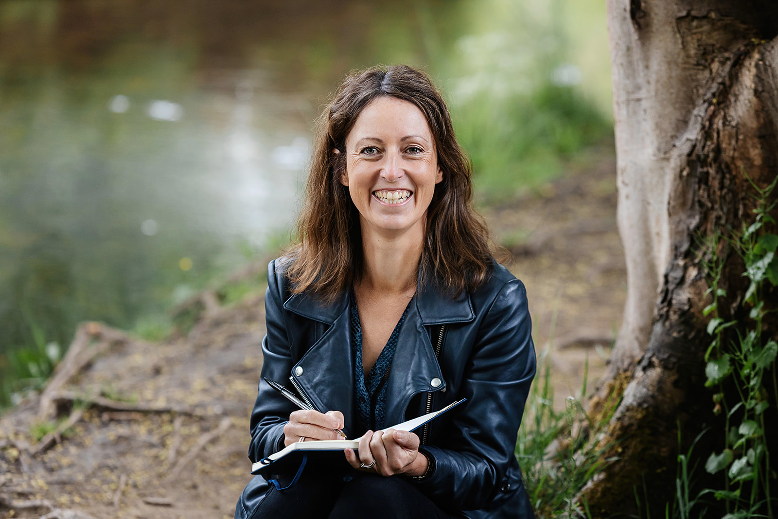 Sophie, of Sophie Seddon PR sat beside the river in Magdale, Honley, Holfmirth.